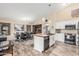 Open concept kitchen and dining area featuring a central island and modern appliances at 2108 E Patrick Ln, Phoenix, AZ 85024