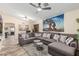 Comfortable living room with a sectional sofa, ceiling fan, and neutral color palette at 2108 E Patrick Ln, Phoenix, AZ 85024