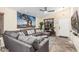 Comfortable living room with a sectional sofa, ceiling fan, and neutral color palette at 2108 E Patrick Ln, Phoenix, AZ 85024