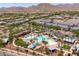 Aerial view showcasing the community pool area and mountain views in this desirable neighborhood at 2120 N Heritage St, Buckeye, AZ 85396