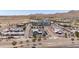 Commercial district aerial view featuring shopping centers, businesses, roadways, and a hotel in the distance at 2120 N Heritage St, Buckeye, AZ 85396