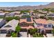 Aerial view of the neighborhood showcasing homes with solar panels and mountain views at 2120 N Heritage St, Buckeye, AZ 85396