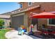Expansive backyard includes play area and a covered patio for outdoor living and entertaining at 2120 N Heritage St, Buckeye, AZ 85396