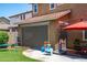 Spacious backyard features a patio with dining, a play area, and privacy landscaping at 2120 N Heritage St, Buckeye, AZ 85396