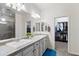 Bathroom boasts dual sinks, tile floors, and a large mirror in a well-lit space at 2120 N Heritage St, Buckeye, AZ 85396