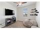 Spare bedroom with ceiling fan and window; a great room or tv room at 2120 N Heritage St, Buckeye, AZ 85396