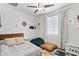 Bright bedroom featuring a ceiling fan, window, and comfortable beanbag seating at 2120 N Heritage St, Buckeye, AZ 85396