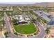 An aerial view showcases the community center, pool, and green space, surrounded by residences at 2120 N Heritage St, Buckeye, AZ 85396