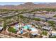 This is an aerial view of a large community pool and clubhouse near residential homes at 2120 N Heritage St, Buckeye, AZ 85396