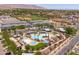 Aerial view highlighting the community pool, cabanas and lounging areas of this Gathering neighborhood at 2120 N Heritage St, Buckeye, AZ 85396