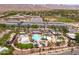 This aerial view shows a community pool with lounge areas and Gathering fun for all ages at 2120 N Heritage St, Buckeye, AZ 85396