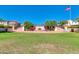 Green space featuring a water feature, flowers, steps, and benches in a sunny community at 2120 N Heritage St, Buckeye, AZ 85396