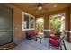 Cozy covered patio with outdoor seating, perfect for relaxing and entertaining at 2120 N Heritage St, Buckeye, AZ 85396