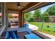 Inviting covered patio with comfortable seating and view of the backyard play area at 2120 N Heritage St, Buckeye, AZ 85396