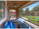 Relaxing covered patio with a ceiling fan, cozy seating, and views of the play area at 2120 N Heritage St, Buckeye, AZ 85396