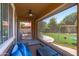 Cozy covered patio with a ceiling fan, comfortable seating, and play area views at 2120 N Heritage St, Buckeye, AZ 85396