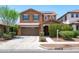 Inviting two-story home featuring a two-car garage and well-maintained landscaping at 2120 N Heritage St, Buckeye, AZ 85396