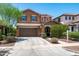 Inviting two-story home featuring a two-car garage and well-maintained landscaping at 2120 N Heritage St, Buckeye, AZ 85396