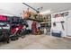 Spacious garage with ample storage, bikes, and equipment, ideal for organization at 2120 N Heritage St, Buckeye, AZ 85396