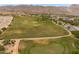 Overhead shot of a golf course with scenic greens and well maintained paths, a golfer's paradise at 2120 N Heritage St, Buckeye, AZ 85396