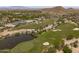 Aerial view of a lush golf course with manicured greens and water features, a golfer's dream at 2120 N Heritage St, Buckeye, AZ 85396