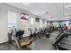 Well-equipped fitness center with treadmills, bikes, weight machines, and TVs for entertainment at 2120 N Heritage St, Buckeye, AZ 85396
