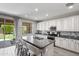 The well-appointed kitchen features granite counters, stainless steel appliances and bar seating at 2120 N Heritage St, Buckeye, AZ 85396