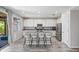 Beautiful kitchen with white cabinets, granite countertops, stainless steel appliances, and bar seating at 2120 N Heritage St, Buckeye, AZ 85396