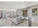 Open kitchen boasts a granite island, stainless steel appliances, bar seating and tile floors at 2120 N Heritage St, Buckeye, AZ 85396