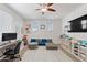 Bright loft space with a study area, comfortable seating, and ample storage shelves at 2120 N Heritage St, Buckeye, AZ 85396