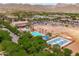 Aerial view of the neighborhood pool and clubhouse, with a blue community basketball court visible at 2120 N Heritage St, Buckeye, AZ 85396