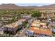 Inviting street lined with shops and apartments, featuring sidewalks and lush landscaping at 2120 N Heritage St, Buckeye, AZ 85396