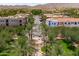 Attractive street featuring tropical palm trees and sidewalks that is lined with shops and businesses at 2120 N Heritage St, Buckeye, AZ 85396