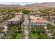 Picturesque street lined with palm trees and sidewalks that leads to inviting shops and businesses at 2120 N Heritage St, Buckeye, AZ 85396