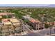 Well-planned street with palm trees, sidewalks, and buildings, featuring an array of businesses and retail spaces at 2120 N Heritage St, Buckeye, AZ 85396