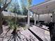 Charming covered back patio with brick paving, outdoor seating, lush landscaping, and string lights at 2339 E Evans Dr, Phoenix, AZ 85022