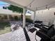 Charming covered back patio with brick paving, outdoor seating, and string lights at 2339 E Evans Dr, Phoenix, AZ 85022