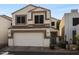 Charming two-story home featuring a red tile roof and a two-car garage at 2339 E Evans Dr, Phoenix, AZ 85022