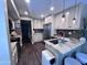 The kitchen features granite countertops, stainless steel appliances, and stylish pendant lighting at 2339 E Evans Dr, Phoenix, AZ 85022