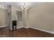Dining room featuring wood-look tile flooring and a modern chandelier at 240 W Juniper Ave # 1211, Gilbert, AZ 85233