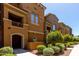 Charming multi-story townhome featuring well-maintained landscaping and a welcoming entrance at 240 W Juniper Ave # 1211, Gilbert, AZ 85233