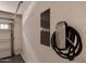 Close up of the electrical box and Tesla charger installed inside the garage at 240 W Juniper Ave # 1211, Gilbert, AZ 85233