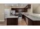 This is a spacious kitchen with stainless steel appliances and granite countertops, complete with a center island at 240 W Juniper Ave # 1211, Gilbert, AZ 85233