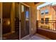 Outdoor patio with sliding glass doors leading inside, showing stairs and nearby balconies at 240 W Juniper Ave # 1211, Gilbert, AZ 85233