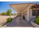 Spacious carport providing covered parking and access to the home at 2529 N Barber Dr, Mesa, AZ 85215