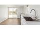 Modern kitchen featuring updated stainless steel sink and faucet at 2529 N Barber Dr, Mesa, AZ 85215
