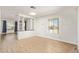 Bright living room featuring hardwood floors, built-in shelving, and a large window at 2529 N Barber Dr, Mesa, AZ 85215