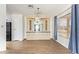 Open living room featuring hardwood floors, built-in cabinets, and large windows at 2529 N Barber Dr, Mesa, AZ 85215