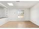 Well-lit living room showcasing hardwood floors and a large window at 2529 N Barber Dr, Mesa, AZ 85215