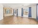 Open concept living room boasts hardwood floors, plenty of natural light, and built-in cabinetry at 2529 N Barber Dr, Mesa, AZ 85215